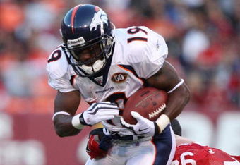 SAN FRANCISCO - AUGUST 14:  Wide receiver Eddie Royal #19 of the Denver Broncos runs tries to break the tackle by Justin Smith #94 of the San Francisco 49ers during the preseason game on August 14, 2009 at Candlestick Park in San Francisco, California. (Photo by Jed Jacobsohn/Getty Images)