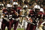 MEMPHIS, TN - DECEMBER 29:  Anthony Dixon #24 of the Mississippi State Bulldogs celebrates with his team his touchdown against the UCF Knights during the 49th Annual Autozone Liberty Bowl at Liberty Bowl Memorial Stadium December 29, 2007 in Memphis, Tennessee. The Bulldogs beat the Knights 10-3.  (Photo by Joe Murphy/Getty Images)