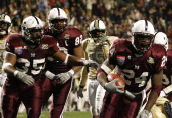 MEMPHIS, TN - DECEMBER 29:  Anthony Dixon #24 of the Mississippi State Bulldogs celebrates with his team his touchdown against the UCF Knights during the 49th Annual Autozone Liberty Bowl at Liberty Bowl Memorial Stadium December 29, 2007 in Memphis, Tennessee. The Bulldogs beat the Knights 10-3.  (Photo by Joe Murphy/Getty Images)