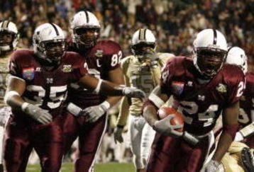 MEMPHIS, TN - DECEMBER 29:  Anthony Dixon #24 of the Mississippi State Bulldogs celebrates with his team his touchdown against the UCF Knights during the 49th Annual Autozone Liberty Bowl at Liberty Bowl Memorial Stadium December 29, 2007 in Memphis, Tennessee. The Bulldogs beat the Knights 10-3.  (Photo by Joe Murphy/Getty Images)