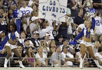 ARLINGTON, TX - AUGUST 21:  Dallas Cowboys Cheerleaders perform for the fans before the Cowboys take the field against the Tennessee Titans during a preseason game at Cowboys Stadium on August 21, 2009 in Arlington, Texas. (Photo by Tom Pennington/Getty Images)