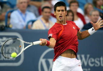 CINCINNATI - AUGUST 22:  Novak Djokovic of Serbia hits a forehand against Rafael Nadal of Spain in their semi final during day six of the Western & Southern Financial Group Masters on August 22, 2009 at the Lindner Family Tennis Center in Cincinnati, Ohio. Djokovic won the match 6-1 and 6-4.     (Photo by Nick Laham/Getty Images)