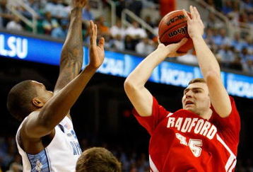 GREENSBORO, NC - MARCH 19:  Artsiom Parakhouski #45 of the Radford Highlanders shoots against Tyler Hansbrough #50 and Deon Thompson #21 the North Carolina Tar Heels during the first round of the NCAA Division I Men's Basketball Tournament at the Greensboro Coliseum on March 19, 2009 in Greensboro, North Carolina.  (Photo by Streeter Lecka/Getty Images)