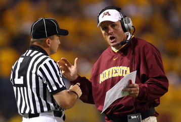 MINNEAPOLIS - SEPTEMBER 13:  Minnesota Golden Gophers' head coach Tim Brewster talks with an official during the game against the Montana State Bobcats at the Metrodome on September 13, 2008 in Minneapolis, Minnesota. Minnesota defeated Montana State 35-23.  (Photo by Jeff Gross/Getty Images)