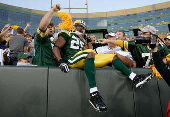 GREEN BAY, WI - AUGUST 22: Running back Ryan Grant #25 of the Green Bay Packers jumps in the stands to celebrate with fans after scoring a touchdown against the Buffalo Bills at Lambeau Field on August 22, 2009 in Green Bay. Wisconsin.  (Photo by Scott Boehm/Getty Images)