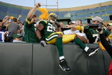 GREEN BAY, WI - AUGUST 22: Running back Ryan Grant #25 of the Green Bay Packers jumps in the stands to celebrate with fans after scoring a touchdown against the Buffalo Bills at Lambeau Field on August 22, 2009 in Green Bay. Wisconsin.  (Photo by Scott Boehm/Getty Images)
