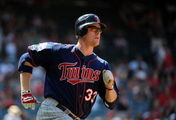 ANAHEIM, CA - JULY 26:  Justin Morneau #33 of the Minnesota Twins runs to first against the Los Angeles Angels of Anaheim at Angels Stadium on July 26, 2009 in Anaheim, California.  (Photo by Harry How/Getty Images)