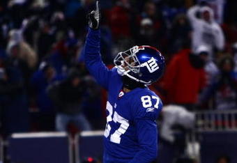 EAST RUTHERFORD, NJ - DECEMBER 21:  Wide receiver Domenik Hixon #87 of the New York Giants of celebrates in the endzone after scoring a touchdown against the Carolina Panthers on December 21, 2008 at Giants Stadium in East Rutherford, New Jersey.  (Photo by Chris McGrath/Getty Images)