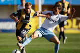 GOSFORD, AUSTRALIA - AUGUST 22:  Adam Kwasnik of the Mariners is challenged by Karol Kisel of Sydney during the round three A-League match between the Central Coast Mariners and Sydney FC at Bluetongue Stadium on August 22, 2009 in Gosford, Australia.  (Photo by Brendon Thorne/Getty Images)