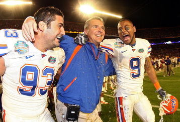 MIAMI - JANUARY 08:  Head coach Urban Meyer of the Florida Gators gets gatorade dumped on him as Javier Estopinan #93 and Louis Murphy #9 look on towards the end of the game against the Oklahoma Sooners in the FedEx BCS National Championship Game at Dolphin Stadium on January 8, 2009 in Miami, Florida.  The Gators wons the game by a score of 24-14.  (Photo by Donald Miralle/Getty Images)