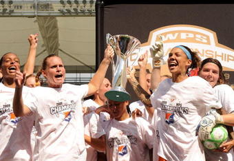 CARSON, CA - AUGUST 22:  Captain and Head Coach Christie Rampone #3 of the New Jersey Blue Sky FC celebrates with Natasha Kai #6 and her teammates  after a 1-0 win over the Los Angeles Sol during the WPS Championship at The Home Depot Center on August 22, 2009 in Carson, California.  (Photo by Harry How/Getty Images)