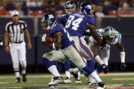 EAST RUTHERFORD, NJ - AUGUST 17:  Danny Ware #28 of the New York Giants runs the ball against the Carolina Panthers on August 17, 2009 at Giants Stadium in East Rutherford, New Jersey. The Giants defeated the Panthers 24-17.  (Photo by Jim McIsaac/Getty Images)