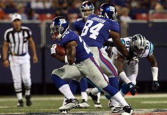 EAST RUTHERFORD, NJ - AUGUST 17:  Danny Ware #28 of the New York Giants runs the ball against the Carolina Panthers on August 17, 2009 at Giants Stadium in East Rutherford, New Jersey. The Giants defeated the Panthers 24-17.  (Photo by Jim McIsaac/Getty Images)