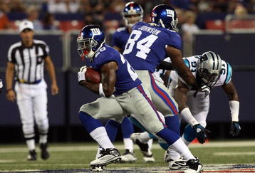 EAST RUTHERFORD, NJ - AUGUST 17:  Danny Ware #28 of the New York Giants runs the ball against the Carolina Panthers on August 17, 2009 at Giants Stadium in East Rutherford, New Jersey. The Giants defeated the Panthers 24-17.  (Photo by Jim McIsaac/Getty Images)
