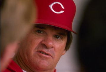 1989:  Infielder and designated hitter Pete Rose, now a coach, of the Cincinnati Reds, talks with a player.     Mandatory Credit:  Allen Dean Steele/Allsport
