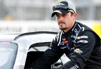 BRISTOL, TN - AUGUST 21:  Casey Mears, driver of the #07 Jack Daniel's Chevrolet, pushes his car after qualifying for the NASCAR Sprint Cup Series Sharpie 500 at Bristol Motor Speedway on August 21, 2009 in Bristol, Tennessee.  (Photo by Geoff Burke/Getty Images for NASCAR)