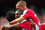 LONDON, ENGLAND - AUGUST 22:  Abou Diaby of Arsenal celebrates his goal with teammate Eduardo (L) and Kieran Gibbs during the Barclays Premier League match between Arsenal and Portsmouth at the Emirates Stadium on August 22, 2009 in London, England.  (Photo by Mike Hewitt/Getty Images)