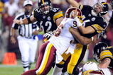 LANDOVER, MD - AUGUST 22:  Charlie Batch #16 of the Pittsburgh Steelers is hit by Cornelius Griffin #96 of the Washington Redskins at Fed Ex Field on August 22, 2009 in Landover, Maryland.  (Photo by Greg Fiume/Getty Images)