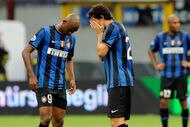 MILAN, ITALY - AUGUST 23:  Diego Milito (R) and Samuel Eto'o of Inter Milan look dejected during the Serie A match between Inter Milan and Bari at Giuseppe Meazza Stadium on August 23, 2009 in Milan, Italy.  (Photo by Claudio Villa/Getty Images)