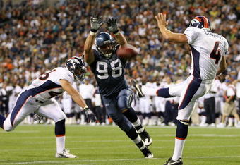 SEATTLE - AUGUST 22:  Defensive end Nick Reed #98 of the Seattle Seahawks just misses blocking a punt by Britton Colquitt #4 of the Denver Broncos on August 22, 2009 at Qwest Field in Seattle, Washington. The Seahawks defeated the Broncos 27-13. (Photo by Otto Greule Jr/Getty Images)