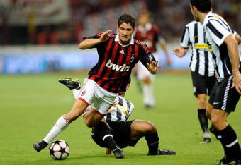 MILAN, ITALY - AUGUST 17:  Pato of Milan is taken down during the Luigi Berlusconi Trophy match between Milan AC and Juventus FC at Giuseppe Meazza Stadium on August 17, 2009 in Milan, Italy.  (Photo by Claudio Villa/Getty Images)
