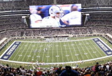 ARLINGTON, TX - AUGUST 21:  Quarterback Tony Romo #9 of the Dallas Cowboys leads his team in the second quarter against the Tennessee Titans during a preseason game at Cowboys Stadium on August 21, 2009 in Arlington, Texas. (Photo by Tom Pennington/Getty Images)