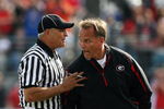 JACKSONVILLE, FL - NOVEMBER 01:  Linesman Lane Thomas holds back head coach Mark Richt of the Georgia Bulldogs after a call went against the Bulldogs while taking on the Florida Gators at Jacksonville Municipal Stadium on November 1, 2008 in Jacksonville, Florida.  (Photo by Doug Benc/Getty Images)