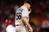 ANAHEIM, CA - AUGUST 12:  Starting pitcher Jarrod Washburn #56 of the Seattle Mariners reacts after giving up a solo home run to Juan Rivera #21 of the Los Angeles Angels of Anaheim during a game at Angel Stadium on August 12, 2008 in Anaheim, California.  (Photo by Christian Petersen/Getty Images)