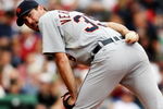 BOSTON - AUGUST 13:  Starting Pitcher Justin Verlander #35 of the Detroit Tigers looks to first base during the game against the Boston Red Sox at Fenway Park on August 13, 2009 in Boston, Massachusetts. (Photo by Elsa/Getty Images)