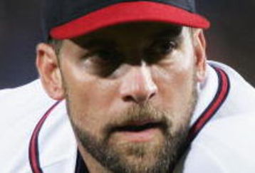ATLANTA - OCTOBER 06:  Starting pitcher John Smoltz #29 of the Atlanta Braves takes the signs from the catcher against the Houston Astros in Game Two of the 2005 National League Division Series on October 6, 2005 at Turner Field in Atlanta, Georgia. Smoltz recorded his 15th post-season victory to break his own record that was tied yesterday by Andy Pettitte of Astros as the Braves defeated the Astros 7-1 to even the series at 1-1.  (Photo by Brian Bahr/Getty Images)