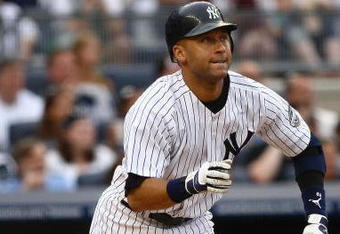 NEW YORK - AUGUST 08:  Derek Jeter #2 of the New York Yankees runs to first base against the Boston Red Sox during their game on August 8, 2009 at Yankee Stadium in the Bronx borough of New York City.  (Photo by Chris McGrath/Getty Images)