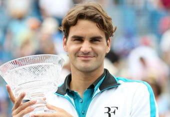 CINCINNATI - AUGUST 23:  Roger Federer of Switzerland holds the winners trophy aloft after defeating Novak Djokovic of Serbia in the Singles Final during day seven of the Western & Southern Financial Group Masters on August 23, 2009 at the Lindner Family Tennis Center in Cincinnati, Ohio.  (Photo by Nick Laham/Getty Images)