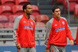 AMSTERDAM, NETHERLANDS - AUGUST 11:  Joleon Lescott walks with Gareth Barry during the England Training Session at the Amsterdam Arena on August 11, 2009 in Amsterdam, Netherlands.  (Photo by Michael Regan/Getty Images)