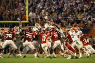 MIAMI - JANUARY 08:  Carlos Dunlap #8 of the Florida Gators blocks a 49-yard field goal attempt in the third quarter by Jimmy Stevens #17 of the Oklahoma Sooners during the FedEx BCS National Championship game at Dolphin Stadium on January 8, 2009 in Miami, Florida.  (Photo by Doug Benc/Getty Images)