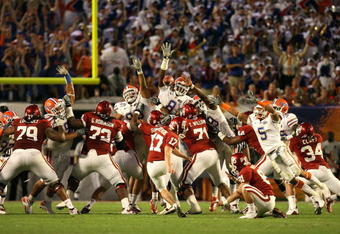 MIAMI - JANUARY 08:  Carlos Dunlap #8 of the Florida Gators blocks a 49-yard field goal attempt in the third quarter by Jimmy Stevens #17 of the Oklahoma Sooners during the FedEx BCS National Championship game at Dolphin Stadium on January 8, 2009 in Miami, Florida.  (Photo by Doug Benc/Getty Images)