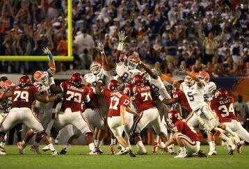 MIAMI - JANUARY 08:  Carlos Dunlap #8 of the Florida Gators blocks a 49-yard field goal attempt in the third quarter by Jimmy Stevens #17 of the Oklahoma Sooners during the FedEx BCS National Championship game at Dolphin Stadium on January 8, 2009 in Miami, Florida.  (Photo by Doug Benc/Getty Images)