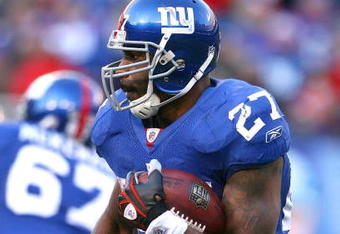 EAST RUTHERFORD, NJ - JANUARY 11:  Brandon Jacobs #27 of the New York Giants runs with the ball during the NFC Divisional Playoff Game against the Philadelphia Eagles on January 11, 2009 at Giants Stadium in East Rutherford, New Jersey.  The Eagles defeated the Giants 23-11. (Photo by Al Bello/Getty Images)