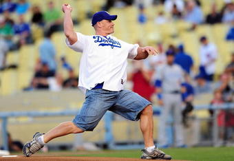 LOS ANGELES, CA - AUGUST 20: WWE Superstar John Cena throws the ceremonial first pitch for the Los Angeles Dodgers as they play the Chicago Cubs on August 20, 2009 at Dodger Stadium in Los Angeles, California. (Photo by Jacob de Golish/Getty Images)