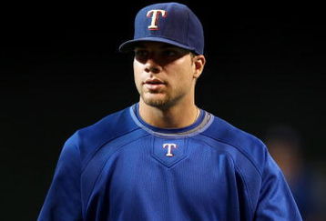 PHOENIX - JUNE 23:  Chris Davis #19 of the Texas Rangers warms up before the major league baseball game against the Arizona Diamondbacks at Chase Field on June 23, 2009 in Phoenix, Arizona. The Diamondbacks defeated the Rangers 8-2.  (Photo by Christian Petersen/Getty Images)