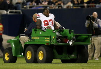 CHICAGO - AUGUST 22: Jay Alford #93 of the New York Giants is taken off the field on a cart after he was injured against the Chicago Bears during their preseason NFL game at Soldier Field on August 22, 2009 in Chicago, Illinois.  (Photo by Jonathan Daniel/Getty Images)