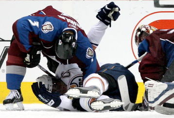 DENVER - MARCH 19:  Ethan Moreau #18 of the Edmonton Oilers gets pinned by Lawrence Nycholat #3 of the Colorado Avalanche during NHL action at the Pepsi Center on March 19, 2009 in Denver, Colorado. The Oilers defeated the Avalanche 8-1.  (Photo by Doug Pensinger/Getty Images)