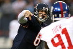 CHICAGO - AUGUST 22: Quarterback #6 of the Chicago Bears throws a pass under pressure against the New York Giants during their preseason NFL game at Soldier Field on August 22, 2009 in Chicago, Illinois.  (Photo by Jonathan Daniel/Getty Images)