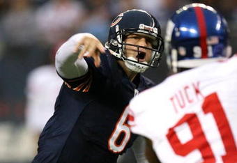 CHICAGO - AUGUST 22: Quarterback #6 of the Chicago Bears throws a pass under pressure against the New York Giants during their preseason NFL game at Soldier Field on August 22, 2009 in Chicago, Illinois.  (Photo by Jonathan Daniel/Getty Images)