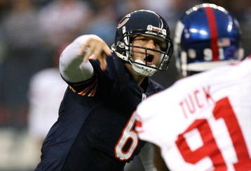CHICAGO - AUGUST 22: Quarterback #6 of the Chicago Bears throws a pass under pressure against the New York Giants during their preseason NFL game at Soldier Field on August 22, 2009 in Chicago, Illinois.  (Photo by Jonathan Daniel/Getty Images)