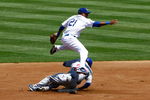 LOS ANGELES, CA - AUGUST 23:  Second baseman Tony Abreu #21 of the Los Angeles Dodgers throws to first base, avoiding the sliding Sam Fuld #27 of the Chicago Cubs to complete the double play in the first inning at Dodger Stadium on August 23, 2009 in Los Angeles, California. The Cubs defeated the Dodgers 3-1.  (Photo by Jeff Gross/Getty Images)