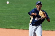 GOODYEAR , AZ - MARCH 06: Alcides Escobar #21 of the Milwaukee Brewers throws over Andy Cannizaro #26 of the Cleveland Indians to complete a double play during the spring training game at Goodyear Ballpark on March 6, 2009 in Goodyear, Arizona. The Brewers defeated the Indians 17-7. (Photo by Christian Petersen/Getty Images)