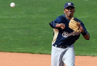 GOODYEAR , AZ - MARCH 06:  Alcides Escobar #21 of the Milwaukee Brewers throws over Andy Cannizaro #26 of the Cleveland Indians to complete a double play during the spring training game at Goodyear Ballpark on March 6, 2009 in Goodyear, Arizona. The Brewers defeated the Indians 17-7.  (Photo by Christian Petersen/Getty Images)