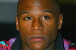 NEW YORK - FEBRUARY 20: Floyd Mayweather listens during the press conference announcing the Junior Middleweight Championship fight against Oscar De La Hoya on February 20, 2007 at the Waldof Astoria Hotel in  New York.  They will fight May 5, 2007 at the MGM Hotel in Las Vegas, Nevada. (Photo by: Al Bello/Getty Images)