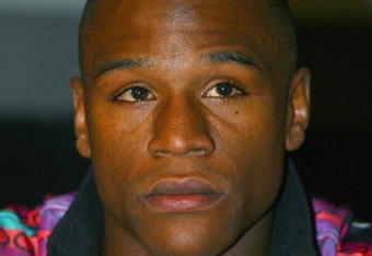NEW YORK - FEBRUARY 20: Floyd Mayweather listens during the press conference announcing the Junior Middleweight Championship fight against Oscar De La Hoya on February 20, 2007 at the Waldof Astoria Hotel in  New York.  They will fight May 5, 2007 at the MGM Hotel in Las Vegas, Nevada. (Photo by: Al Bello/Getty Images)