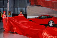 6th Feb 2002:  Michael Schumacher (L) of Germany and Rubens Barrichello of Brazil and Ferrari remove the covers of the new Ferrari car during the press conference held to launch the new Ferrari F2002 Formula One car in Maranello, Italy.  \ Mandatory Credit: Mark Thompson /Allsport